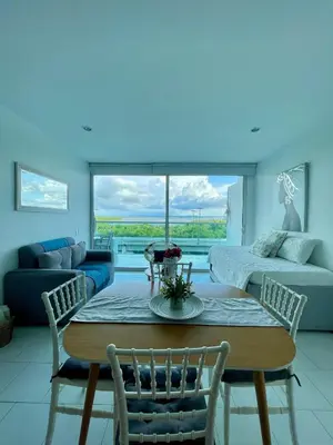 a living room with a table and chairs and a couch at Apartamento en Cartagena cerca al hotel las Américas in Cartagena de Indias