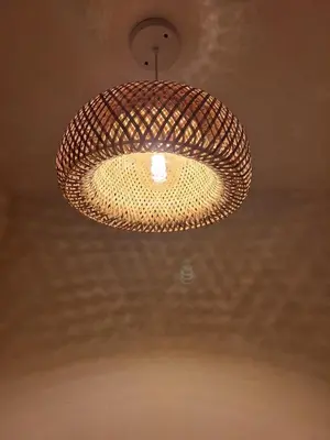 a wicker light fixture hanging from a ceiling at Cartagena zona norte playa uso exclusivo in Cartagena de Indias
