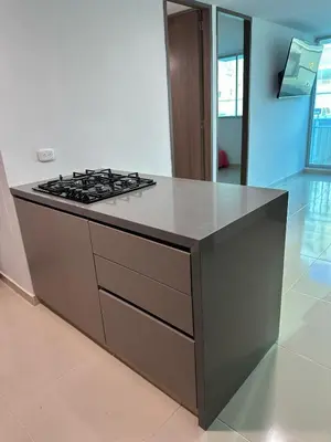 a kitchen with a stove top oven in a room at Apartamento moderno en zona norte exclusiva in Barranquilla