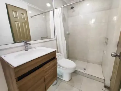 a bathroom with a sink and a toilet and a shower at Cozy 2nd Floor Apartment in Heart of Cartagena in Cartagena de Indias