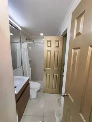 a bathroom with a white toilet and a sink at Cozy 2nd Floor Apartment in Heart of Cartagena in Cartagena de Indias