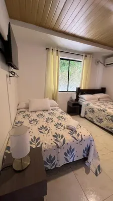 a bedroom with two beds and a window at Apartamento 6 pax in Estación El Salto