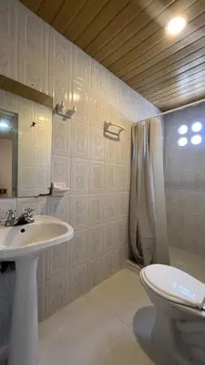 a bathroom with a sink and a toilet at Apartamento 6 pax in Estación El Salto