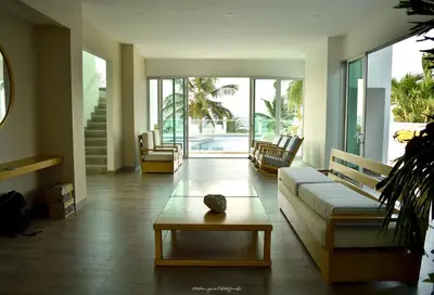 a living room with a couch and a table at Magico Apartamento Frente al Mar 3 Habitaciones CV41 in Coveñitas