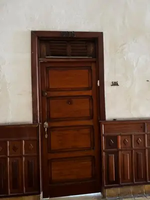 a wooden door in front of a wall at Luxury Loft in Old City Cartagena - 5th in Cartagena de Indias