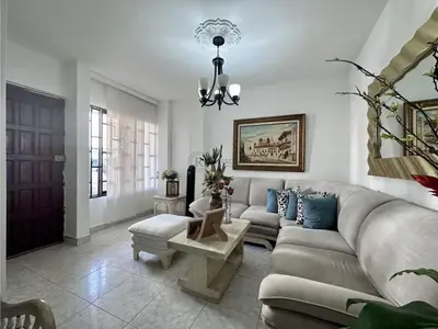 a living room with a couch and a table at Apartamento Pie de la Popa Cartagena - 3 Habitaciones in Cartagena de Indias