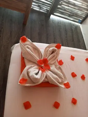 a white cake with a bow on top of it at Venido del mar III in Playa Blanca