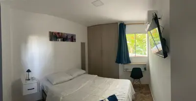 a bedroom with a white bed and a window at Hotel Boutique DL in Cartagena de Indias