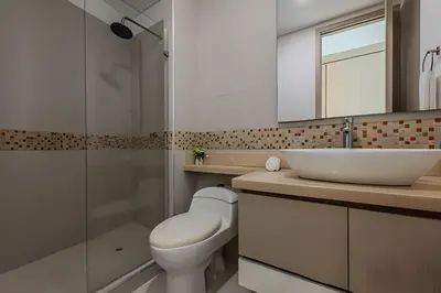 a bathroom with a toilet and a sink and a shower at Espectacular Apto 3 Hab Palmetto Beach 1201 in Cartagena de Indias