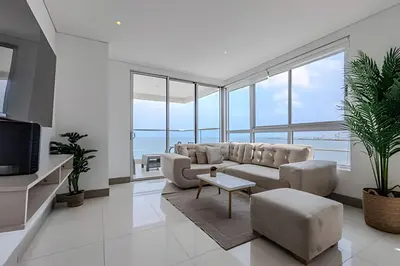 a living room with a couch and a table at Espectacular Apto 3 Hab Palmetto Beach 1201 in Cartagena de Indias