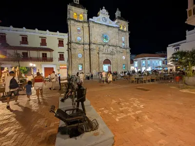 a large building with a clock tower at night at Bizsar Mar 4 Piscinas Acceso privado playa BBQ privado in Cartagena de Indias