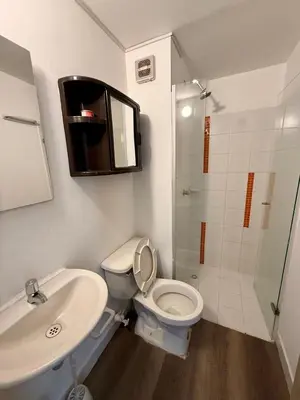 a bathroom with a toilet and a sink and a shower at Casa Ingrid in Cartagena de Indias
