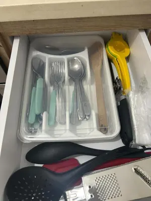 a drawer filled with utensils in a drawer at Confortable Apartamento in Barranquilla