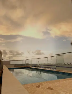 a swimming pool on the top of a building at Apartment 5 minutes from the Airport, Sea and Center in Cartagena de Indias