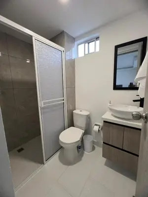 a bathroom with a toilet and a sink and a shower at Apartment 5 minutes from the Airport, Sea and Center in Cartagena de Indias
