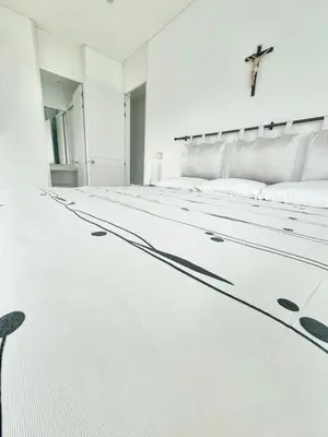 a white room with a cross on the wall at Apartamento de lujo frente al mar in Coveñas