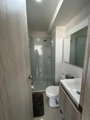 a bathroom with a shower and a toilet and a sink at Modern Apartment in Barranquilla in Barranquilla