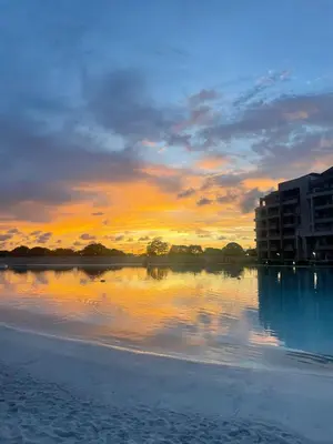 a sunset over a body of water with buildings at Apto de Ensueño en aguas cristalinas Baía Kristal in Cartagena de Indias
