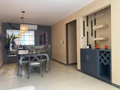 a dining room with a table and some chairs at Apartamento Los Lagos in Cartagena de Indias