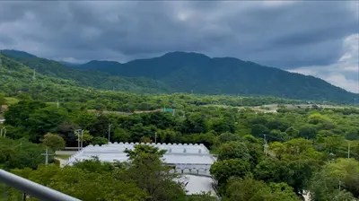 a view of a building with mountains in the background at VISTA BAHIA Santa Marina Santa Marta in Santa Marta
