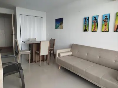 a living room with a couch and a table at Cartagena Search in the Historic Center T6 in Cartagena de Indias
