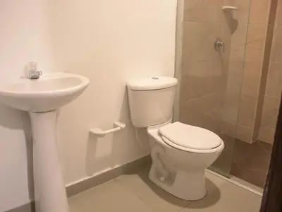 a bathroom with a toilet and a sink and a shower at Casa gimani Betts in Cartagena de Indias