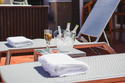 a table with two glasses and bottles of champagne at Suite Premium con Terraza y Jacuzzi Privado in Cartagena de Indias