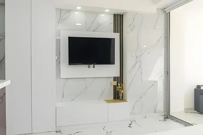 a television on a wall in a white room at Escape to Paradise - Oceanfront in Cartagena in Cartagena de Indias