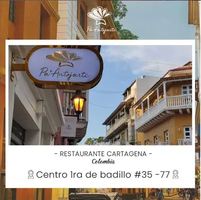 a sign for a restaurant in front of a building at Historic Getaway with Breakfast in Cartagena de Indias