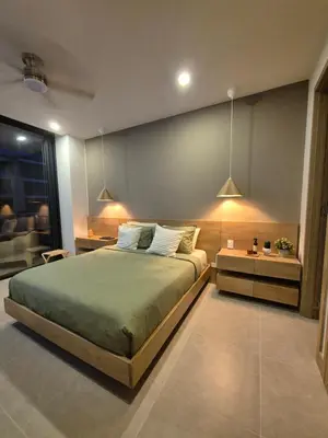 a bedroom with a large bed and a table at Apartamento moderno con vista al mar y piscinas 1 habitación con balcón en Manzanillo,Cartagena in Cartagena de Indias