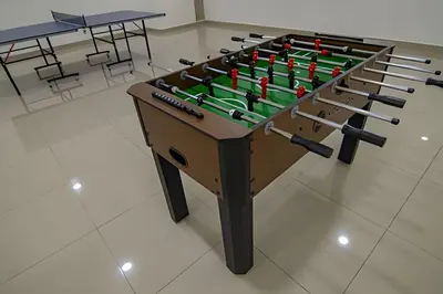 a foosball table with guns on top of it at 16th Floor Infinitum 1 Bedroom Apt in Cartagena de Indias