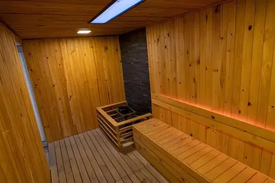 an inside of a wooden sauna with wood paneling at 16th Floor Infinitum 1 Bedroom Apt in Cartagena de Indias