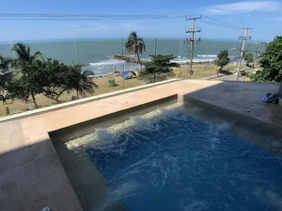 a swimming pool with a view of the beach at Hermoso Apto - 2 Hab Piso- 17 Murano Elite in Cartagena de Indias