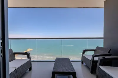 a room with chairs and a large window at 1704 Morros City - Espectacular Apto en Bocagrande in Cartagena de Indias