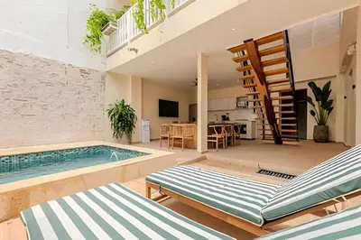 a living room with a swimming pool and a house at Casa Encanto - Corazón de Getsemaní in Cartagena de Indias
