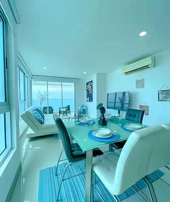 a dining room with a table and chairs at 1705 Palmetto Beach -17th Floor Palmetto Beach in Cartagena de Indias