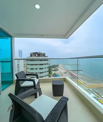 a balcony with chairs and a view of the ocean at 1705 Palmetto Beach -17th Floor Palmetto Beach in Cartagena de Indias