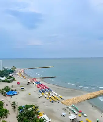 an aerial view of a beach with cars and umbrellas at 1705 Palmetto Beach -17th Floor Palmetto Beach in Cartagena de Indias