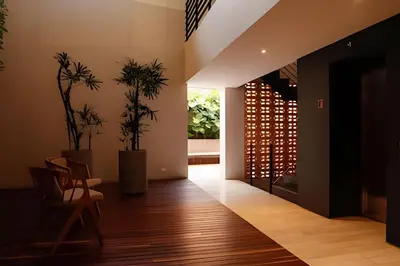 a living room with a table and chairs and plants at Relaxing New Apt w/ Balcony in Getsemani! in Cartagena de Indias