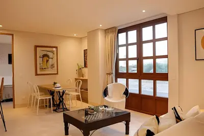 a living room with a couch and a table at Relaxing New Apt w/ Balcony in Getsemani! in Cartagena de Indias