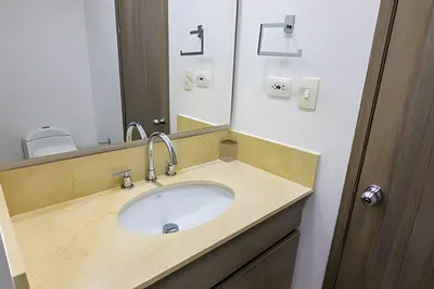 a bathroom with a sink and a mirror at Hermoso Apto Frente al Mar - Morros City piso 9 in Cartagena de Indias