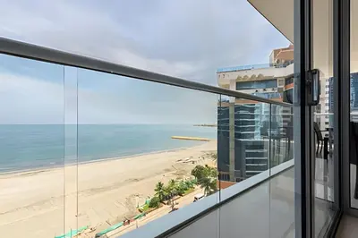 a view of the beach from the balcony of a building at Hermoso Apto Frente al Mar - Morros City 801 in Cartagena de Indias