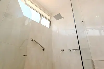 a bathroom with a shower with a glass door at Espectacular Vista Al Mar - Ed. Infinito 2302 in Cartagena de Indias