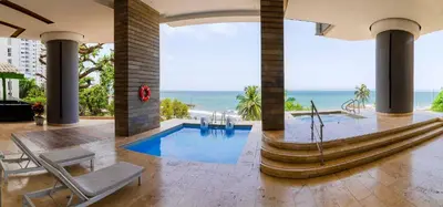 a house with a pool and a view of the ocean at Lujoso Apto de 1 Habitación en Piso 24-Murano E in Cartagena de Indias