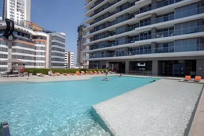 a large swimming pool in front of a large building at Espectacular Apto de 2 Hab Piso 24 - Morros City in Cartagena de Indias