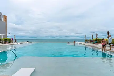 a swimming pool with a view of the ocean at Espectacular Apto de 2 Hab Piso 24 - Morros City in Cartagena de Indias