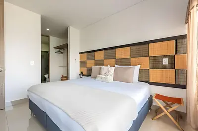 a bedroom with a large white bed in a room at Infinitum - Spectacular sea view 25th floor apt in Cartagena de Indias