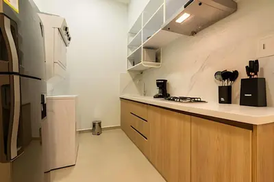 a kitchen with a counter and a refrigerator at Espectacular apto en Centro Histórico - Zaher F in Cartagena de Indias
