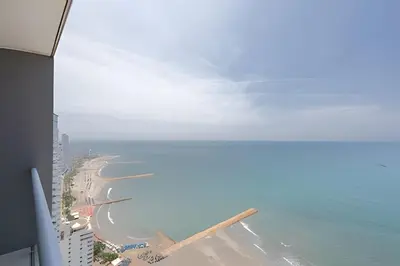 a view of the beach from an airplane window at 3605 Morros City - Paraiso en Cartagena in Cartagena de Indias