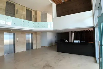 an empty lobby with a desk in a building at Lujoso Apto Vista al Mar Piso 34 - Palmetto Beach in Cartagena de Indias